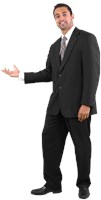 Hussein wearing a suit and thining holding his left hand out. 589