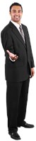 Hussein wearing a suit, smiling, thinking, and holding his right hand out  591