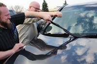 checking windshield on an automobile 886