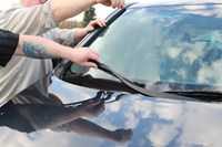 Fitting or cleaning a windshield into a vehicle 888